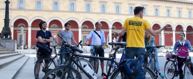 Sightseeing by bike with stop at former Residenzpost in Munich